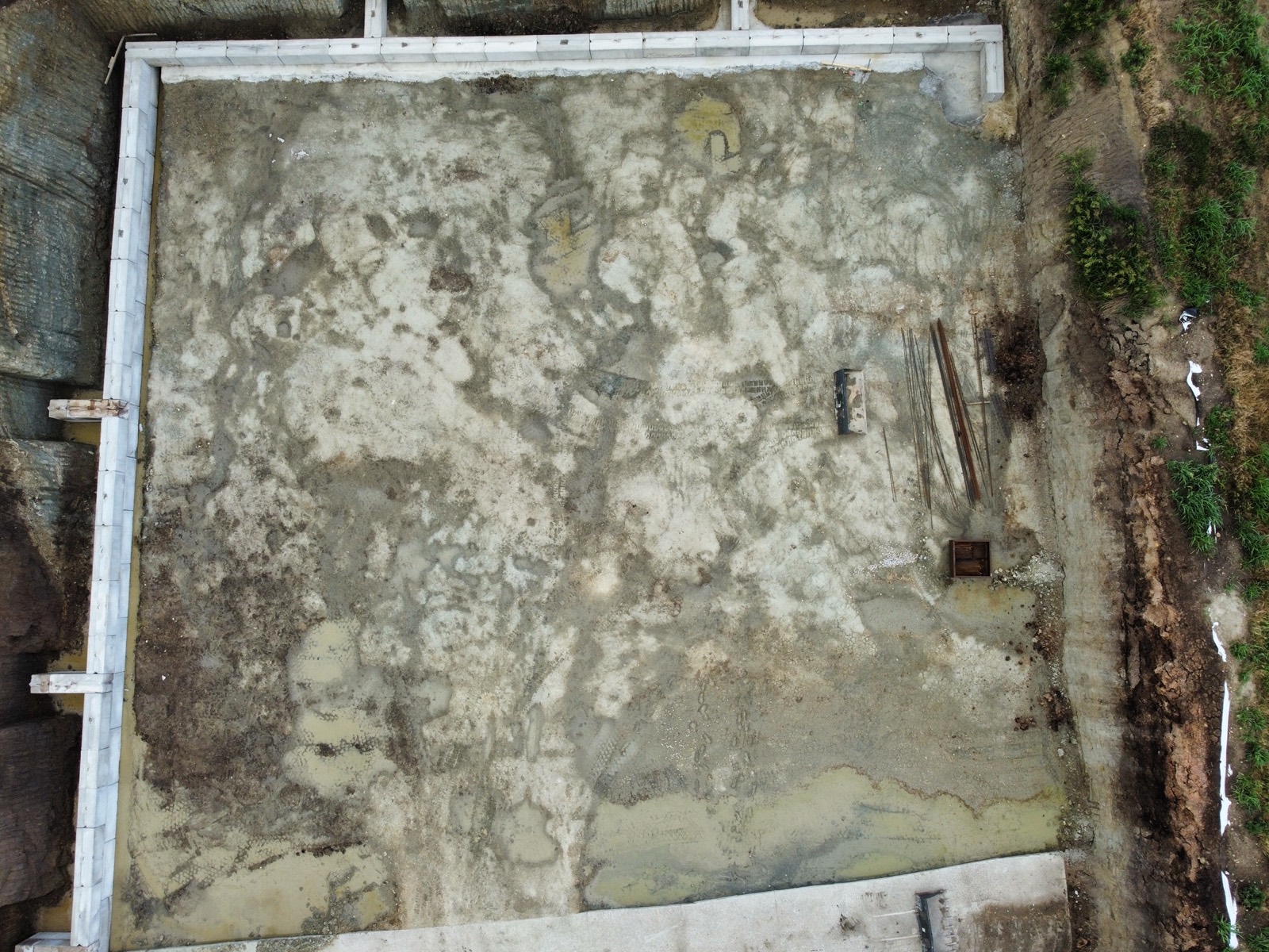 Excavated pit with prepped base before the pour