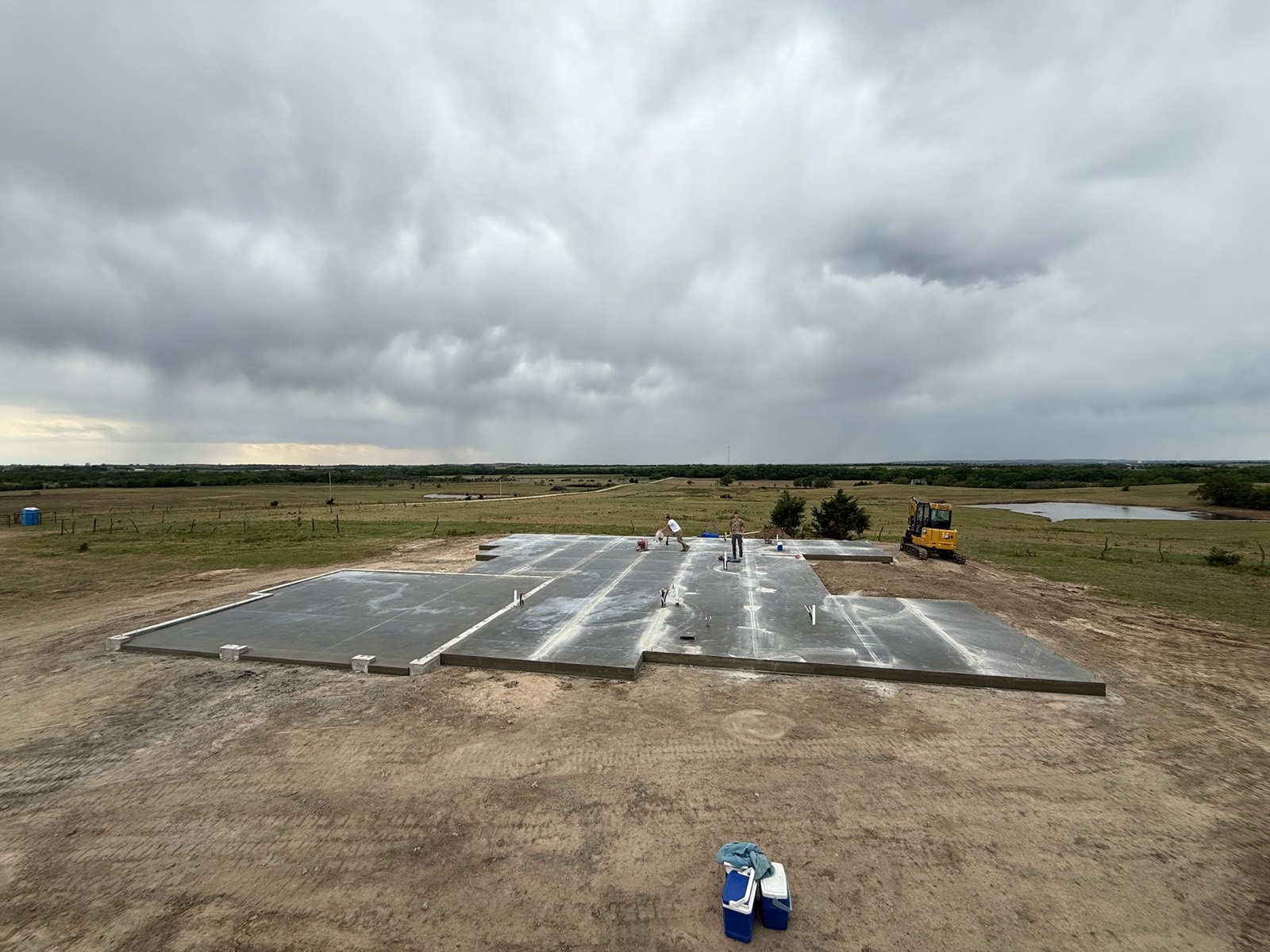 Large concrete slab foundation on a rural site